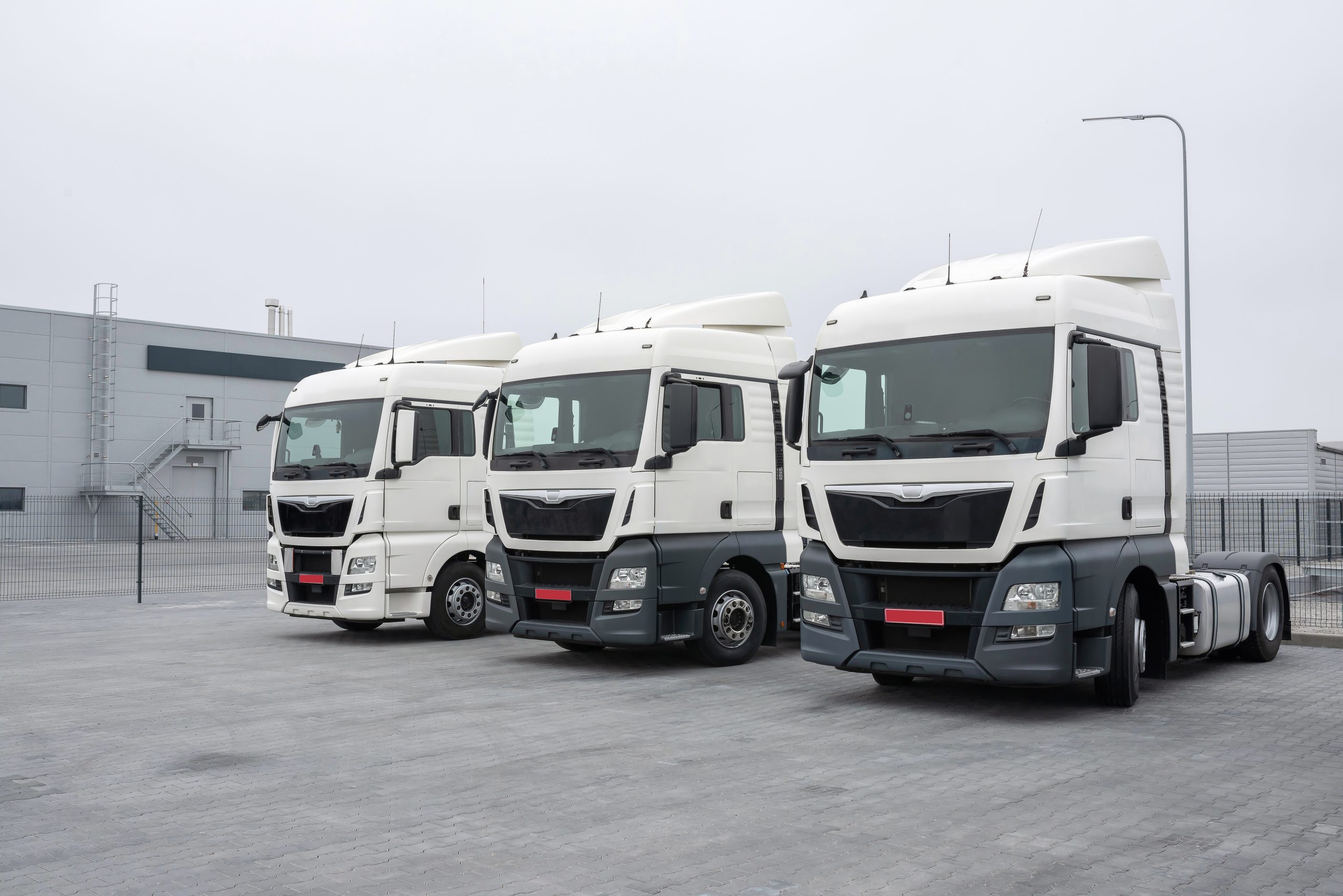Parked trucks. Freight road transport, Freight transport, car service. Logistic and transport concept